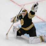 Boston Bruins goaltender Linus Ullmark (35) makes a glove save on Toronto Maple Leafs center Auston Matthews (34) shot during the second quarter of game 2 round 1 of the NHL Playoffs at TD Garden.