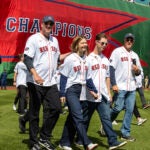 Red Sox vs. Baltimore Orioles Opening Day at Fenway Park (left)Derek Lowe and Mike Timlin (right) escort Brianna and Trevor Wakefield on the field for opening day ceremonies.