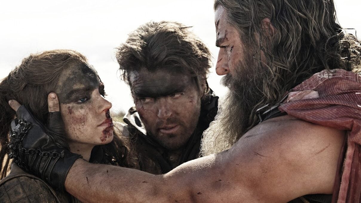 Anya Taylor-Joy, Tom Burke, and Chris Hemsworth in "Furiosa: A Mad Max Saga."