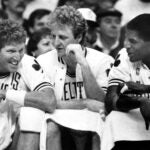 From left, Boston Celtics' Bill Walton, Larry Bird and Robert Parish share a laugh on the bench in the final minutes of a 1987 game.