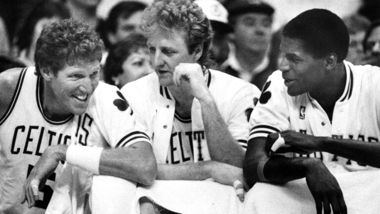 From left, Boston Celtics' Bill Walton, Larry Bird and Robert Parish share a laugh on the bench in the final minutes of a 1987 game.