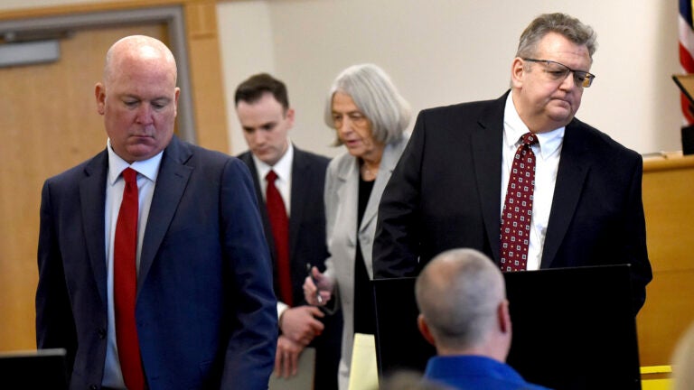 David Meehan sits in court as his attorneys Rus Rilee, left, and David Vicinanzo, right, along with state's attorneys Martha Gaythwaite and Brandon Chase return to the seats after a bench hearing.