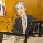 Michael Cohen testifies on the witness stand.