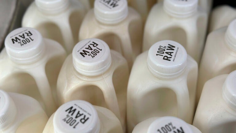 Bottles of raw milk are displayed for sale at a store in Temecula, Calif.