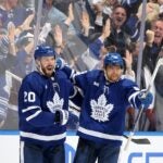 Joel Edmundson #20 and William Nylander #88 of the Toronto Maple Leafs celebrate after Nylander's goal against the Bruins during the third period.