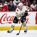 Boston Bruins defenseman Andrew Peeke (52) in action during the second period of an NHL hockey game against the Washington Capitals, Saturday, March 30 2024, in Washington.