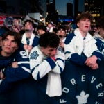 Fans watch the Toronto Maple Leafs play the Boston Bruins in Game 6 of first-round NHL hockey playoff series on a videoscreen outside Scotiabank Arena in Toronto, Thursday, May 2, 2024.