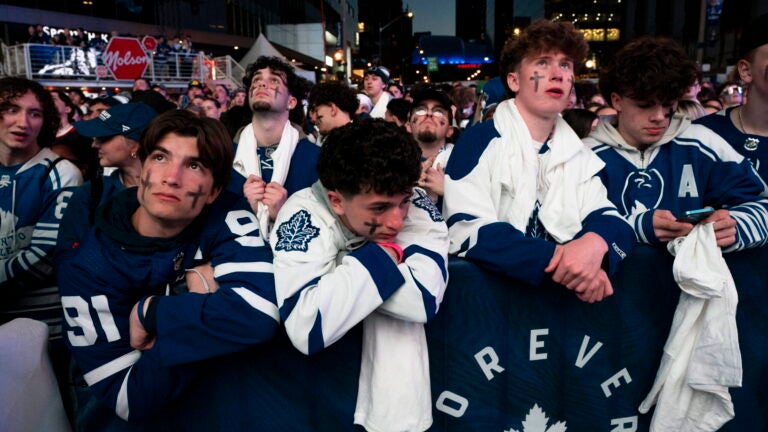 Fans watch the Toronto Maple Leafs play the Boston Bruins in Game 6 of first-round NHL hockey playoff series on a videoscreen outside Scotiabank Arena in Toronto, Thursday, May 2, 2024.