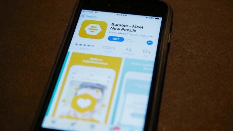 A phone with an App Store selection of the dating app Bumble.