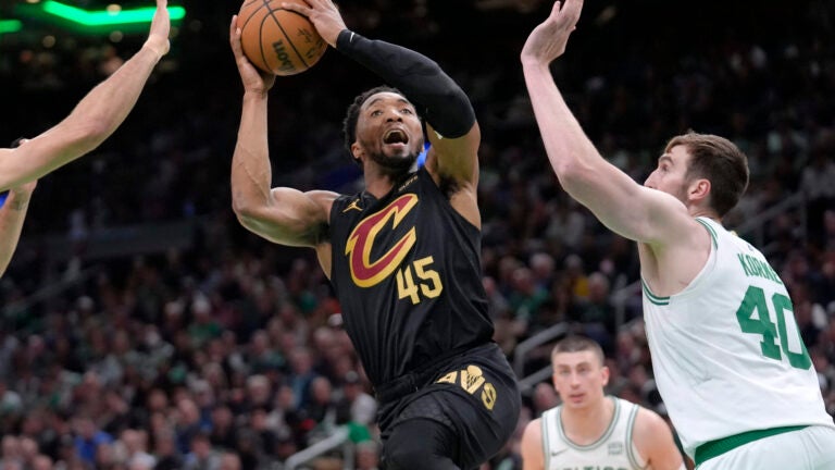 Cavaliers guard Donovan Mitchell shoots as Celtics center Luke Kornet defends during the second half of Game 2.