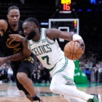 Celtics guard Jaylen Brown drives to the basket against Cleveland Cavaliers forward Isaac Okoro during the second half of Game 1 in Boston.