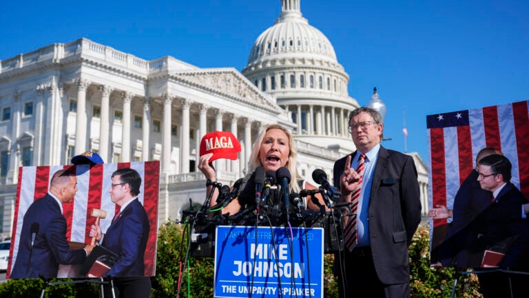 Rep. Marjorie Taylor Greene, R-Ga., joined by Rep. Thomas Massie, R-Ky., says she'll call a vote next week on ousting House Speaker Mike Johnson, R-La., during a news conference at the Capitol in Washington, Wednesday, May 1,