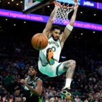 Boston Celtics forward Jayson Tatum (0) dunks over the Indiana Pacers in the first quarter at TD Garden.