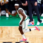 Jrue Holiday (4) gestures after sinking a three-point basket during the third quarter of Game 1 of the NBA Eastern Conference Finals at TD Garden.