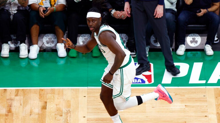 Jrue Holiday (4) gestures after sinking a three-point basket during the third quarter of Game 1 of the NBA Eastern Conference Finals at TD Garden.