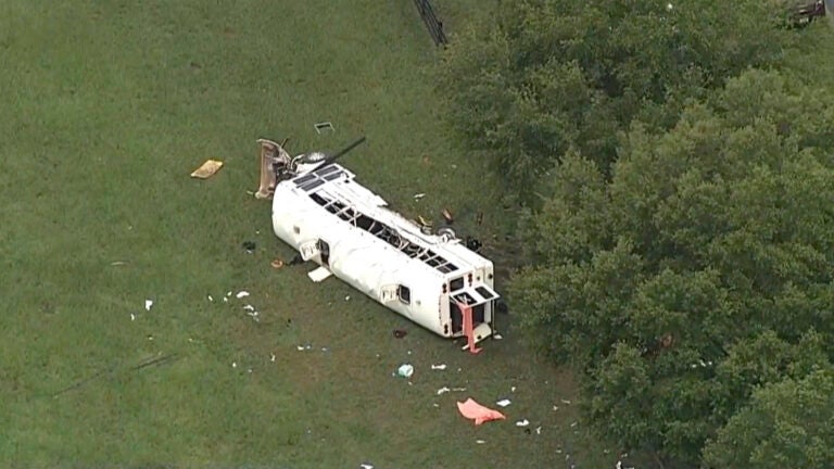 Emergency personnel work the scene of a deadly crash on Tuesday, May 14, 2024 in Marion County, Fla.