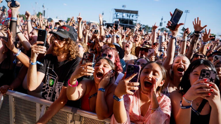 Diverse Crowd Enjoying Live Music at a Concert in Boston