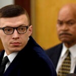 Volodymyr Zhukovskyy looks back at the gallery before closing statements started at his trial at Coos County Superior Court in Lancaster, N.H., on Tuesday, Aug. 9, 2022.