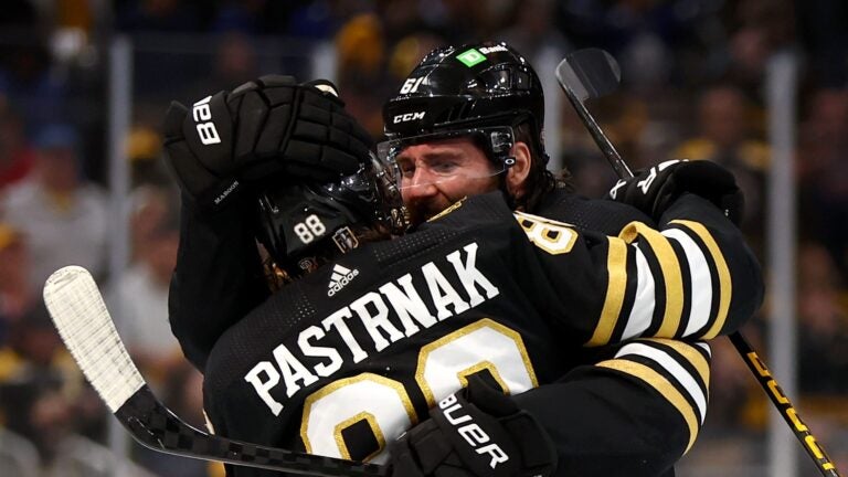 BOSTON, MASSACHUSETTS - MAY 04: David Pastrnak #88 of the Boston Bruins celebrates with his teammate Pat Maroon #61 after scoring the game winning goal against the Toronto Maple Leafs during overtime in Game Seven of the First Round of the 2024 Stanley Cup Playoffs at TD Garden on May 04, 2024 in Boston, Massachusetts.