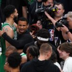 Jayson Tatum of the Boston Celtics and head coach Joe Mazzulla hug after winning Game Four of the Eastern Conference Finals at Gainbridge Fieldhouse on May 27, 2024 in Indianapolis, Indiana.