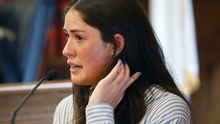 Allie McCabe breaks into tears on the stand Wednesday when recounting the harassment that she and her family have faced.
