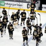 The Boston Bruins raise their sticks to the fans after losing to the Florida Panthers in Game 6 of an NHL hockey Stanley Cup second-round playoff series, Friday, May 17, 2024, in Boston.