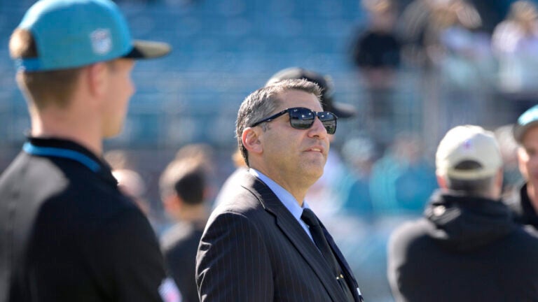 Carolina Panthers vice president of football administration Samir Suleiman, center, watches players warm up in December 2023.