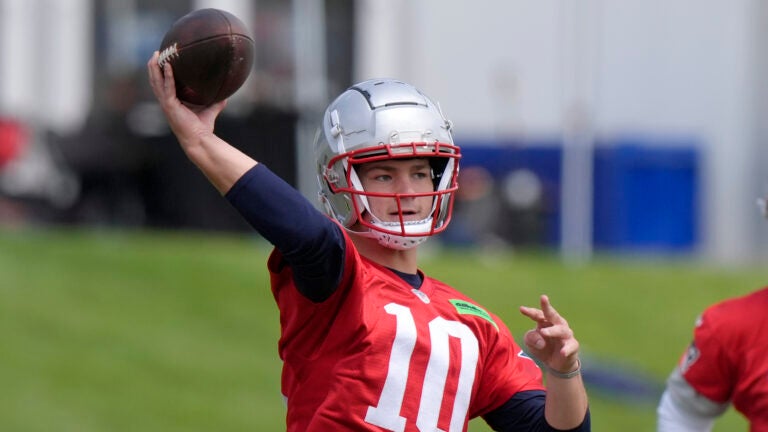 New England Patriots quarterback Drake Maye winds up to pass the the ball during an NFL football offseason workout, Monday, May 20, 2024, in Foxborough, Mass.