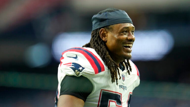New England Patriots linebacker Dont'a Hightower (54) smiles after an NFL football game against the Houston Texans, Sunday, Oct. 10, 2021, in Houston.