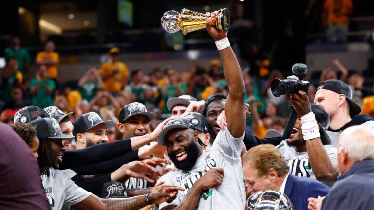 Boston Celtics guard Jaylen Brown (7) holds up his award after winning Game 4 of the NBA Eastern Conference Finals. The Indiana Pacers hosted the Boston Celtics at Gainbridge Fieldhouse in Indianapolis on Monday, May 27, 2024.