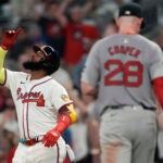 Atlanta Braves designated hitter Marcell Ozuna gestures after driving in the go ahead run with a base hit in the eighth inning. against the Red Sox.