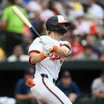 Baltimore Orioles' Kyle Stowers follows through on an RBI single during the seventh inning against the Red Sox, Monday, May 27, 2024, in Baltimore.
