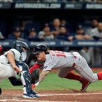 Jarren Duran of the Red Sox steals home ahead of the throw to Tampa Bay catcher Ben Rortvedt during the eighth inning.