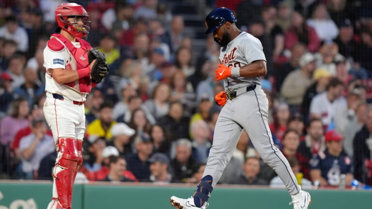 Detroit Tigers' Akil Baddoo arrives at home plate after hitting a home run against the Red Sox during the fifth inning.