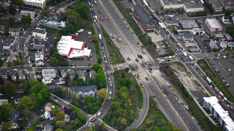 This aerial view looking south shows demolition crews working to finish removing the Fairfield Avenue bridge over Interstate 95, Saturday, May 4, 2024 in Norwalk, Conn.