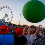 The Flaming Lips launch a large inflatable ball into the crowd at Boston Calling 2023.