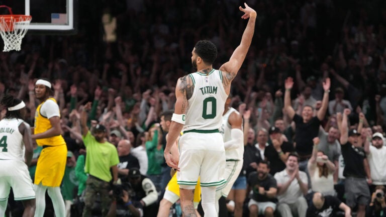 Boston Celtics forward Jayson Tatum (0) signals his three pointer is good on a night when he wasn’t hitting much for a 127-123 lead in overtime. The Boston Celtics host the Indiana Pacers in Game 1 of the NBA Eastern Conference Finals.