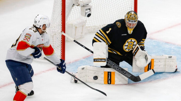Boston Bruins goaltender Jeremy Swayman (1) denies Florida Panthers left wing Carter Verhaeghe (23) shot on goal during first period action in game four of the Eastern Conference NHL second round Playoff game at TD Garden.