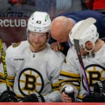 Boston Bruins Jim Montgomery having words with Danton Heinen (43) and Charlie Coyle (13) against the Florida Panthers during third period action in game five of the Eastern Conference NHL second round Playoff game at Amerant Bank Arena.