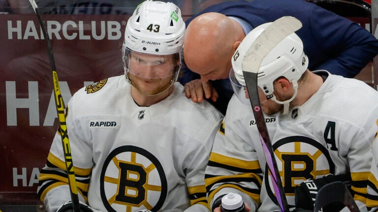 Boston Bruins Jim Montgomery having words with Danton Heinen (43) and Charlie Coyle (13) against the Florida Panthers during third period action in game five of the Eastern Conference NHL second round Playoff game at Amerant Bank Arena.