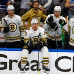 Boston Bruins left wing Brad Marchand (63) and teammates watching from the bench as the Toronto Maple Leafs celebrate their 2-1 victory in game six of the Eastern Conference NHL Playoffs at Scotiabank Arena.