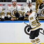 Boston Bruins right wing David Pastrnak (88) skates past his teammates as they watch the Toronto Maple Leafs celebrate their 2-1 victory in game six of the Eastern Conference NHL Playoffs at Scotiabank Arena.