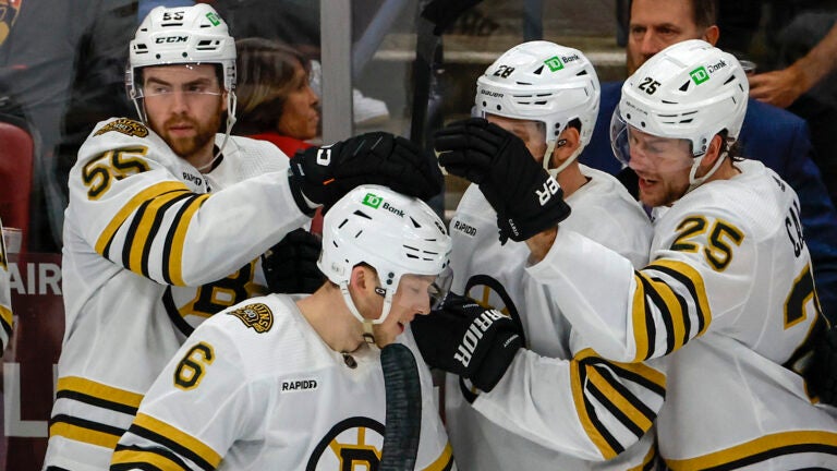 Boston Bruins rookie defenseman Mason Lohrei (6) getting love from his teammates Justin Brazeau (55), Derek Forbort (28) and Brandon Carlo (25) after scoring a goal against the Florida Panthers during second period in game one of the Eastern Conference NHL Playoffs at Amerant Bank Arena.