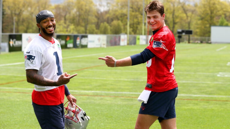 Drake Maye seen in Patriots uniform at NFLPA Rookie Premiere