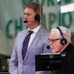 Boston, MA: 12-30-20: The COVID-19 pandemic has caused some major changes to how the Celtics TV broadcasts are produced at NBC Sports Boston, including having color commentator Brian Scalabrine (left) and play by play man Mike Gorman (right, pictured as they get ready to do a pre game stand up) work in a glass partitioned area across from the Boston bench. The Boston Celtics hosted the Memphis Grizzlies in a regular season NBA basketball game at the TD Garden.