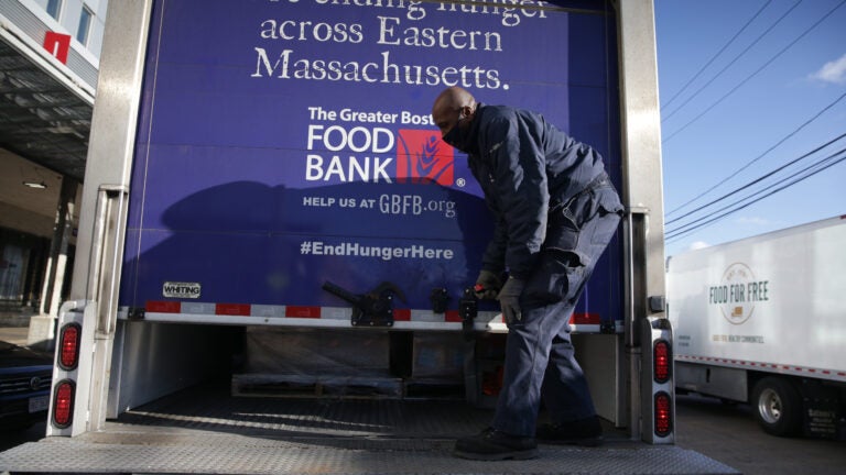 Trucks are being unloaded at the Greater Boston Food Bank.