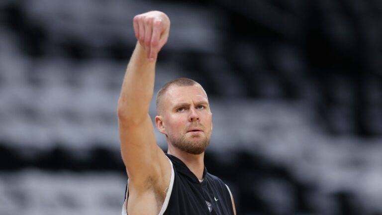 BOSTON, MASSACHUSETTS - JUNE 17: Kristaps Porzingis #8 of the Boston Celtics warms up before Game Five of the 2024 NBA Finals against the Dallas Mavericksat TD Garden on June 17, 2024 in Boston, Massachusetts.