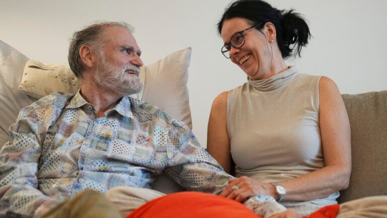 Michael Bommer looks at his wife Anett Bommer.