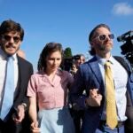 Amanda Knox arrives flanked by her husband Christopher Robinson, right, and her lawyer Luca Luparia Donati.