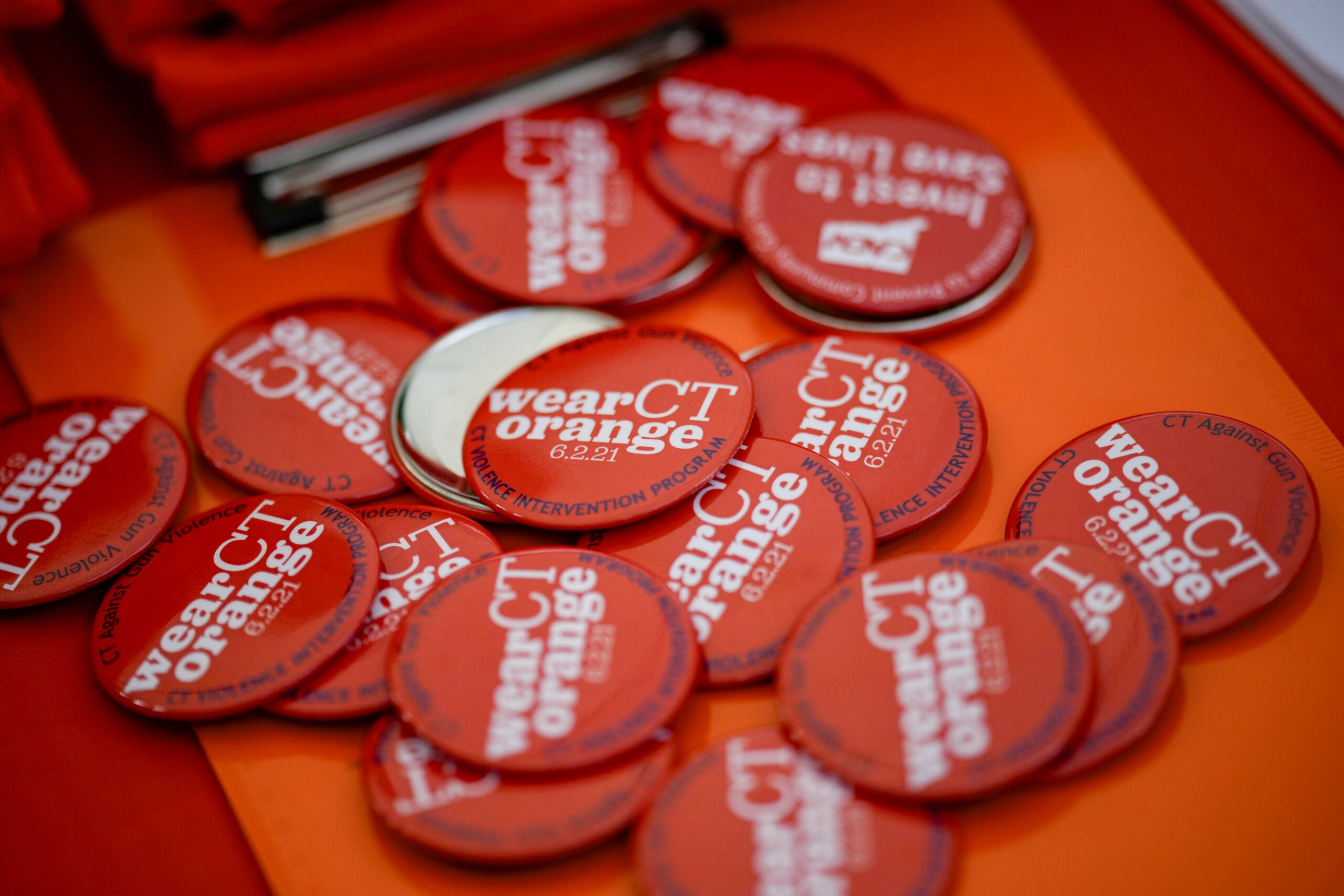 Buttons lay on a table during a rally against gun violence.